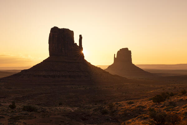a beautiful light envelope the Monument Valley during a summer sunrise, Arizona, United States of America