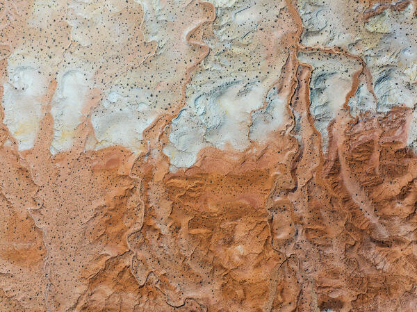 aerial abstract view taken by drone of desert area near to Goblin Valley National Park during a sunny summer day, Utah, United States of America