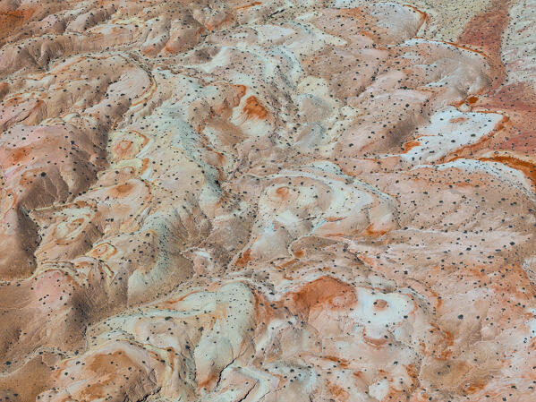 aerial abstract view taken by drone of desert area near to Goblin Valley National Park during a sunny summer day, Utah, United States of America