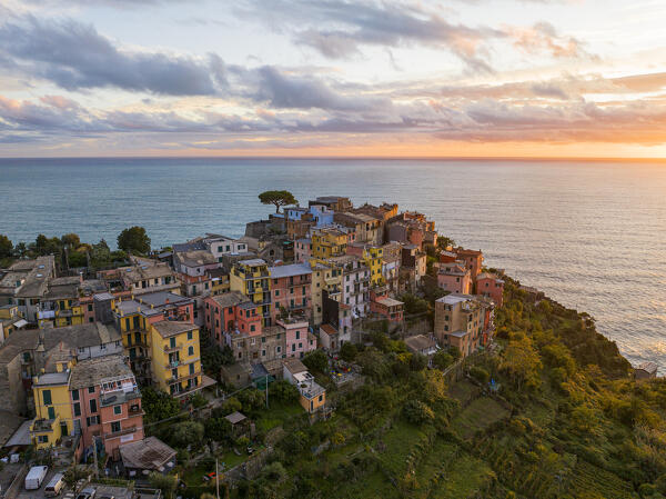 aerial view taken by drone of iconic village of Corniglia during a sunset, Cinque Terre National Park, La Spezia province, Liguria, Italy, Europe