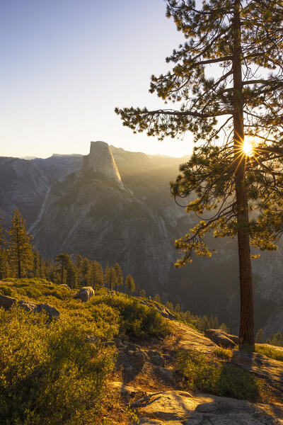 a beautiful sunrise in Yosemite National Park with Half Dome mountain in the foreground, California, United States of America