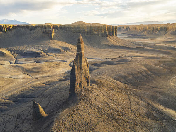 aerial view taken by drone of iconic rock formation called Long Dong Silver Spire during a sunny summer day, Utah, United States of America