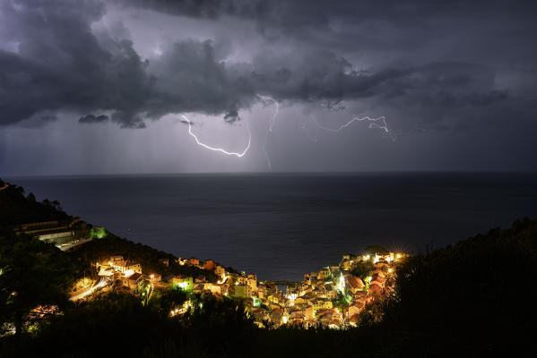 lightning on Riomaggiore on summer night, National Park 5 Terre, municipality of Riomaggiore, La Spezia province, Liguria district, Italy, Europe