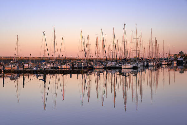 Fano harbor pink reflection at sunset, Pesaro Urbino, Le Marche, Italy                 