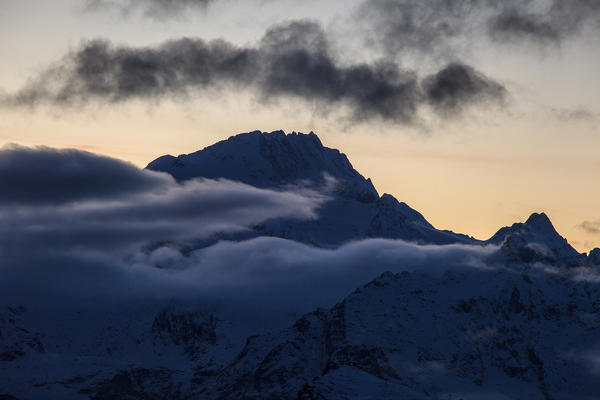 Disgrazia mountain at foggy sunset, Malenco valley, Lombardy, Italy