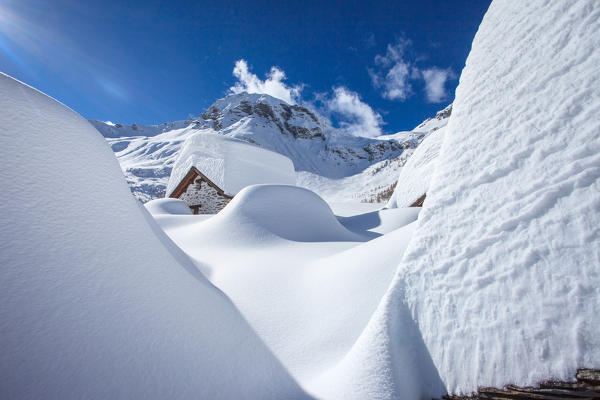 Chiavenna valley, snowy winter to Lendine alp, in the background Pizzaccio mountain, Lombardy, Italy