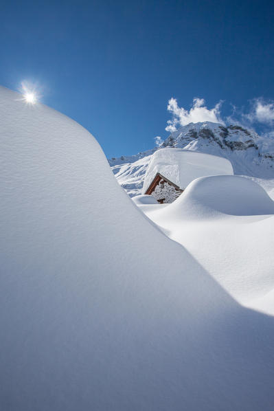 Valtellina, Lombardy, snowy chalet to Lendine alp, Chiavenna valley, Italy