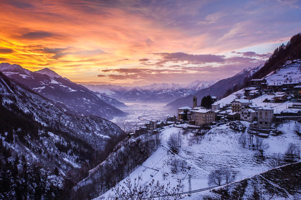 Sunset wintry on the Valtellina, Campo Tartano village, Lombardy, Italy