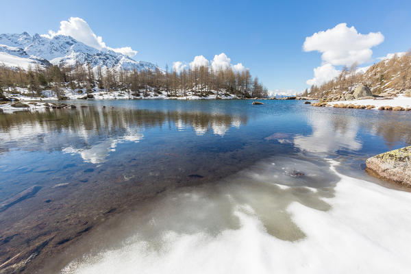 Lago Acque Sparse partially frozen, Val Grosina, Valtellina, province of Sondrio, Lombardy, Italy