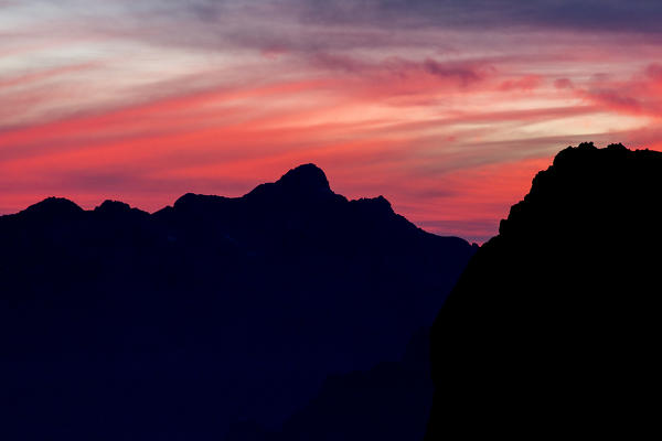 Silouhette of the Ligoncio peak at sunset in Masino valley, Lombardy, Italy