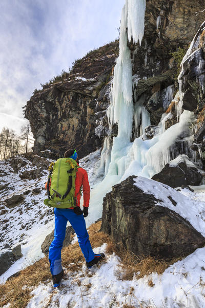 Mountaineer at the Specchi icefall (Cascata degli Specchi), Malenco Valley, Valtellina, Lombardy, province of Sondrio, Italy