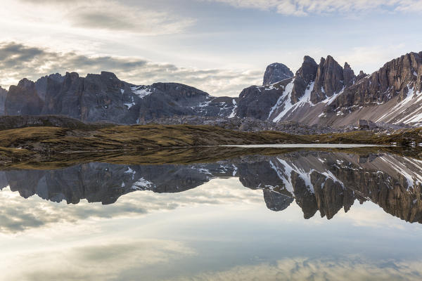 Rocky peaks reflected in Laghi Dei Piani, Dolomites, South Tyrol, province of Bolzano, Italy

