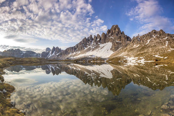 Monte Paterno reflected in clear water of Laghi Dei Piani, Dolomites, South Tyrol, province of Bolzano, Italy
