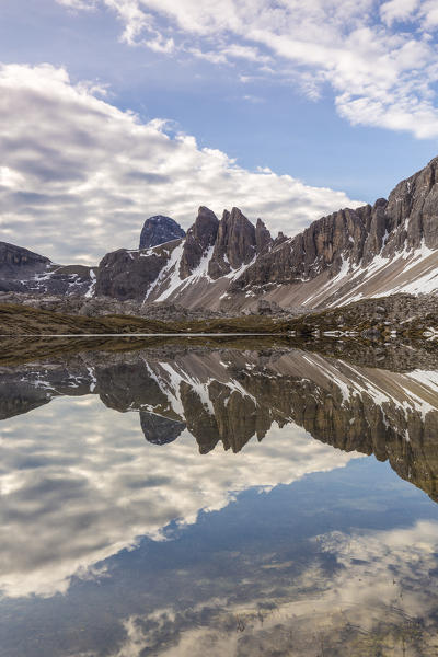 Rocky peaks reflected in Laghi Dei Piani, Dolomites, South Tyrol, province of Bolzano, Italy
