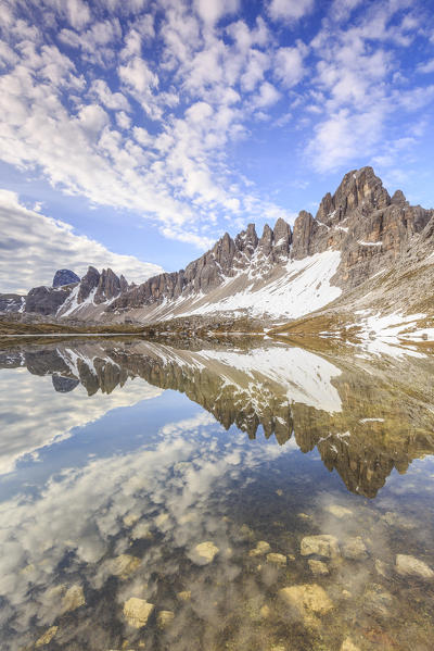 Monte Paterno reflected in clear water of Laghi Dei Piani, Dolomites, South Tyrol, province of Bolzano, Italy
