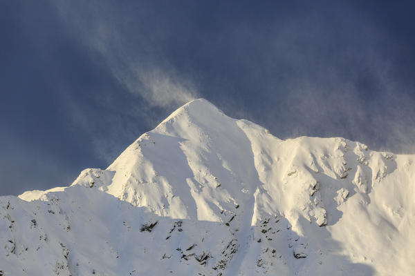 Wind on the snowy peak of Monte Rosetta, Gerola Valley, Sondrio province, Valtellina, Lombardy, Italy