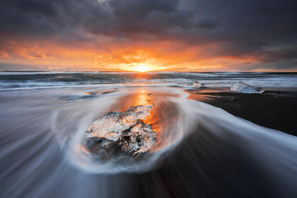 Block of ice at sunrise, Jökulsárlón, Diamond beach, Austurland, Iceland, Northern Europe