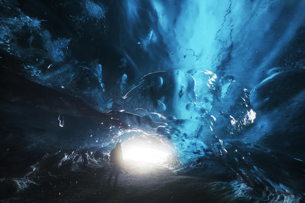 Man in an ice cave, Austurland, Iceland, Northern Europe