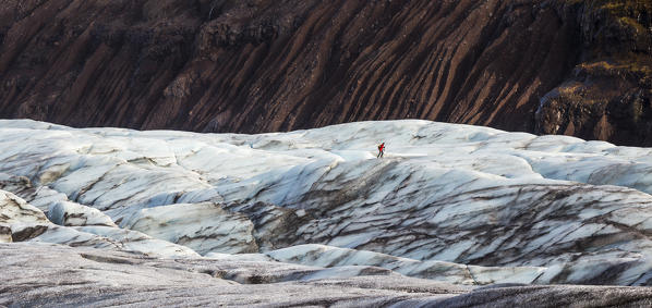 Man walking at Svínafellsjökull, Hornafjörður, Austurland, Iceland, Northern Europe