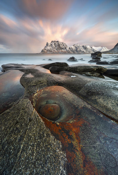 Rock like dragon eye at Uttakleiv beach at sunrise, Leknes, Lofoten, Nordland, Norway, Scandinavia, Northern Europe