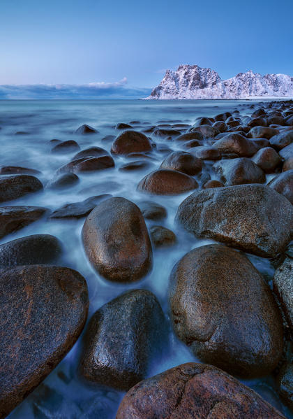 Rocks into the water at Uttakleiv beach at twilight, Leknes, Lofoten, Nordland, Norway, Scandinavia, Northern Europe