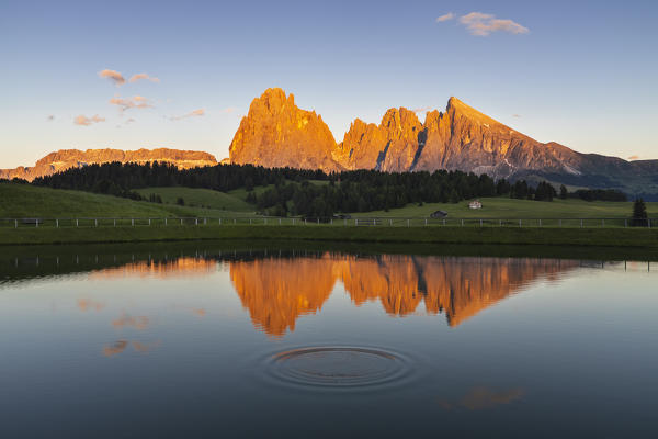 A scenic sunset at Alpe di Siusi in front of Sasso Lungo and reflections, Seiser Alm, Castelrotto, Bolzano, Trentino Alto Adige, Italy, Southern Europe