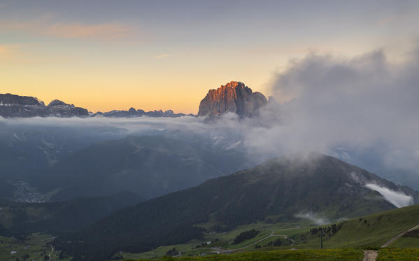 Misty sunrise over Sassolungo from Seceda, Gruppo delle Odle, Dolomiti di Gardena, Bolzano, Trentino Alto Adige, Italy, Southern Europe
