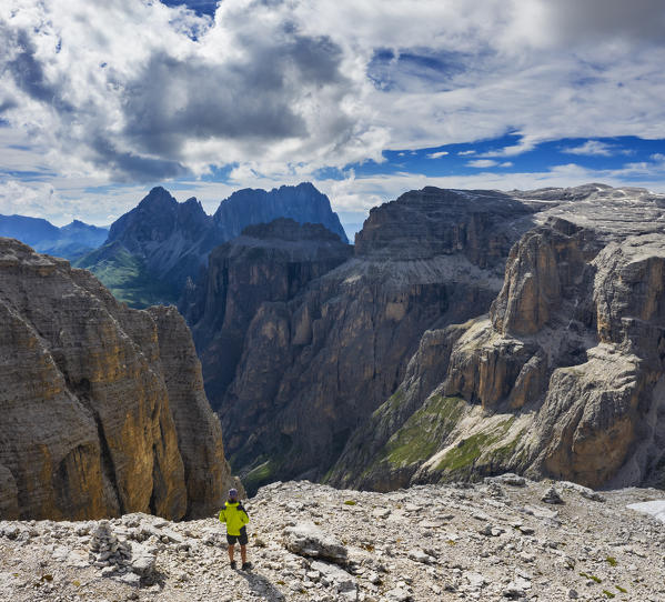 Aerial view of a Man that observes mountains from Sass Pordoi, Belluno, Trento, Trentino Alto Adige, Veneto, Italy, Southern Europe