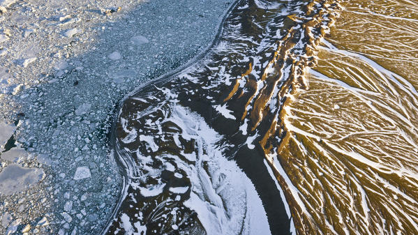 Blocks of ice at sunrise and Jokulsarlon lagoon, Jökulsárlón, Diamond beach, Austurland, Iceland, Northern Europe