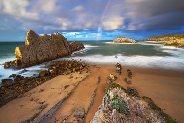 Sunset with rainbow at Playa de la Arnia, Boo de Pielagos, Cantabria, Spain, Iberian Peninsula, Western Europe