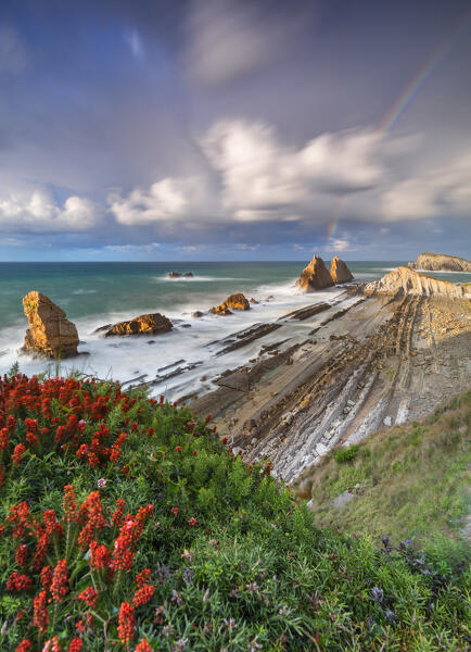 Sunset with rainbow at Playa de la Arnia, Boo de Pielagos, Cantabria, Spain, Iberian Peninsula, Western Europe