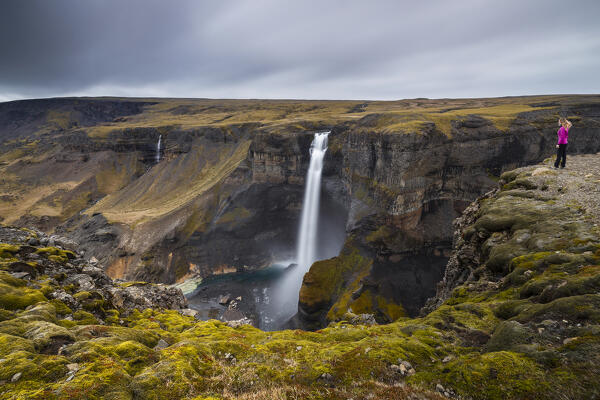 Woman at Hifoss waterfall during summer, Fossa river, Iceland, Northern Europe (MR)