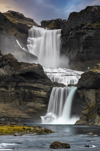 Person at Ofaerufoss waterfall during summer, Eldgja, Highland, Iceland, Northern Europe (MR)