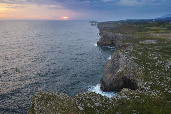 Aerial View of cliffs at Area recreativa de Guadamia and Los Bufones de Pria at sunrise, Ribadesella, Asturias, Spain, Western Europe
