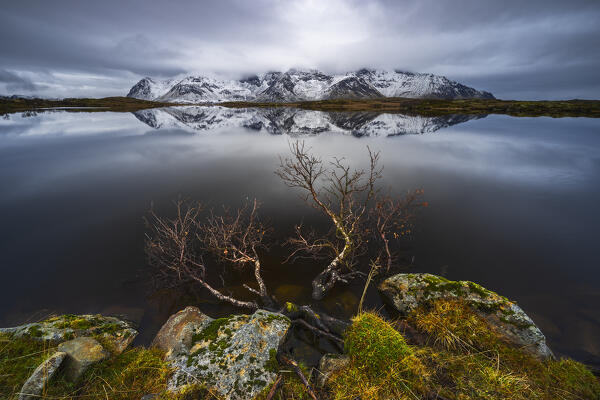 Mountain reflections at Gimsoysand during stormy weather, Vagan, Nordland, Lofoten, Norway, Northern Europe