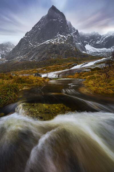 Dusk and waterfalls in a fjord near Flakstad, Flakstadoya, Nordland, Lofoten, Norway, Northern Europe