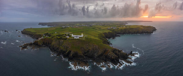 Aerial and panoramic view of Lizard Point Lighthouse at sunrise, Lizard Point, Cornwall, United Kingdom, Northern Europe