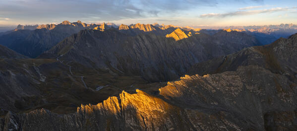 Panoramic and aerial view of Col Agnel at sunrise during summer, Col Agnel, Alpi Cozie, Alpi del Monviso, Cuneo, Piedmont, Italy, Southern Europe 