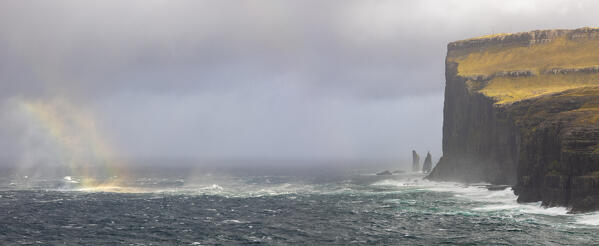 Panoramic view of Risin og Kellingin with rainbow viewed from Tjörnuvik, Eiði, Sunda municipality, Eysturoy, Faroe Islands, Denmark, Scandinavia