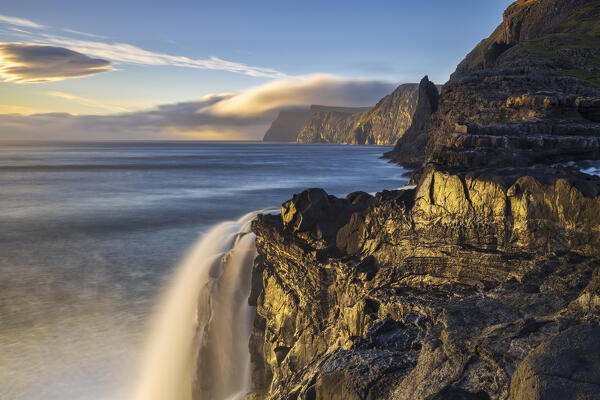 Bøsdalafossur waterfall from Sørvagsvatn at sunset, Vagar, Faroe Islands, Denmark, Scandinavia