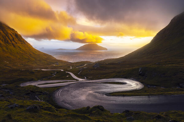 View of Koltur island with a bendings road in the foreground, Streymoy, Torshavnar municipality, Faroe Islands, Denmark, Scandinavia