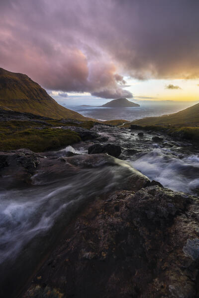 View of Koltur island with a bendings road in the foreground, Streymoy, Torshavnar municipality, Faroe Islands, Denmark, Scandinavia