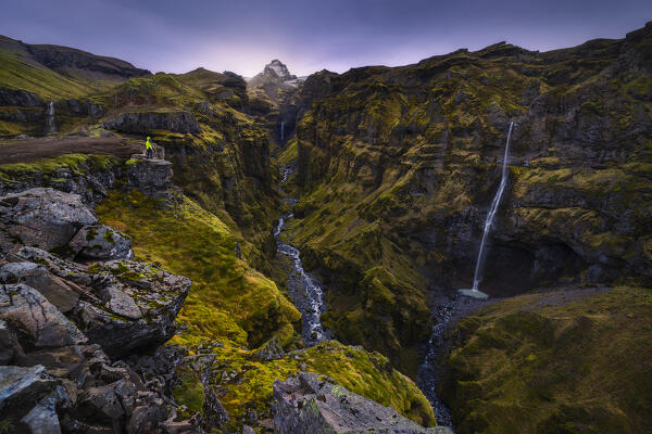 A tourist at Mulagljufur Canyon, southern Iceland, Iceland, Northern Europe (MR)