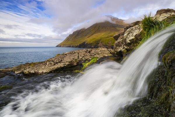 View of Villingadalsfjall mountain from Vidareidi with a waterfall in the foreground, Vidoy, Nordoyar, Faroe Islands, Denmark, Scandinavia