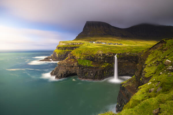 Mulafossur waterfall with Arnafjall and Heinanova mountains in the background, Gasadalur, Vagar, Faroe Islands, Denmark, Scandinavia