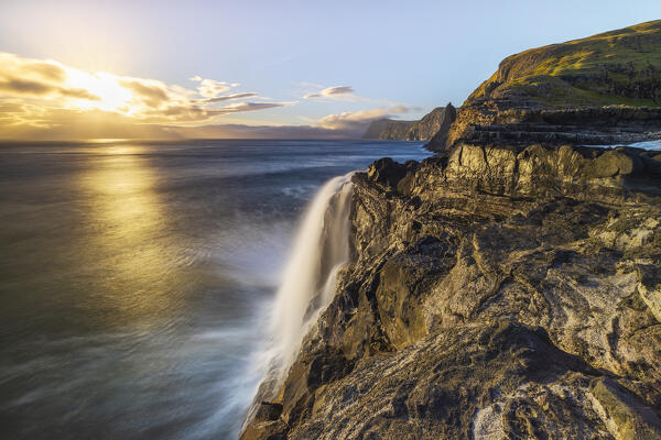 Bosdalafossur waterfall at sunset, Sorvagsvatn, Vagar, Faroe Islands, Denmark, Scandinavia