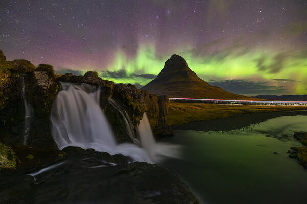 Northern lights at Kirkjufellfoss, Kirkjufell, Grundafjordur, Snaefellsnes peninsula, Vesturland region, Iceland, Northern Europe
