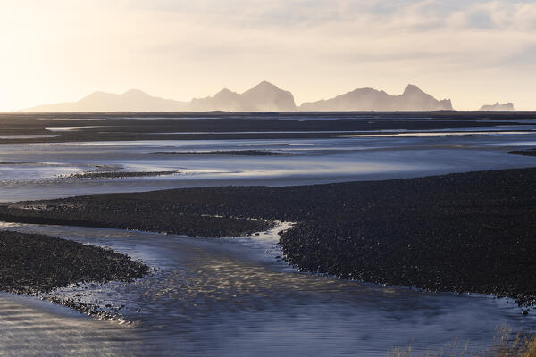 Heimaey island at sunset viewed from south coast, Vestmannaeyjar, southern Iceland, Iceland, Northern Europe