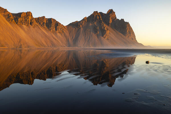 Vestrahorn reflected at sunrise, Stokksnes peninsula, Hofn, Austurland, Iceland, Northern Europe