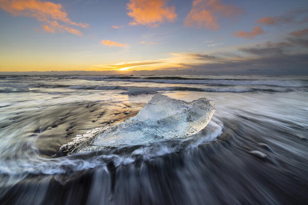 Block of ice at Diamon beach during sunrise, Jökulsárlón, Diamond beach, Austurland, Iceland, Northern Europe